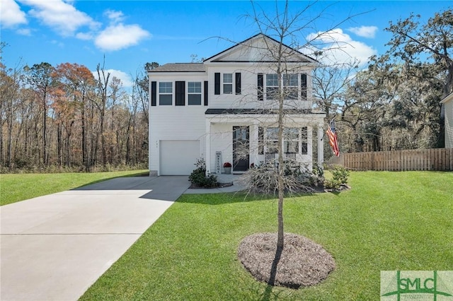 view of front of property with an attached garage, driveway, a front yard, and fence