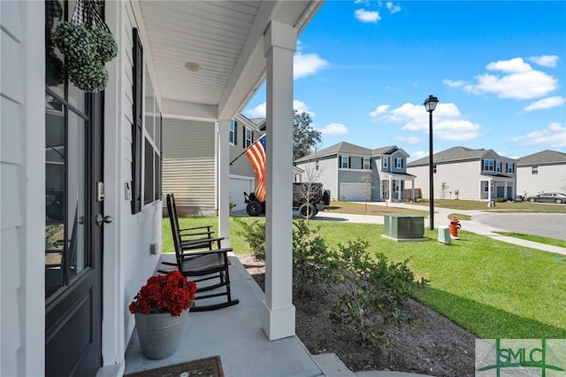 view of patio / terrace with a porch and a residential view