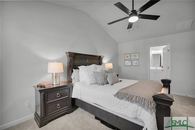bedroom featuring baseboards, light colored carpet, and vaulted ceiling