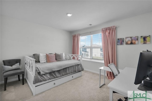 bedroom featuring visible vents, baseboards, and light carpet