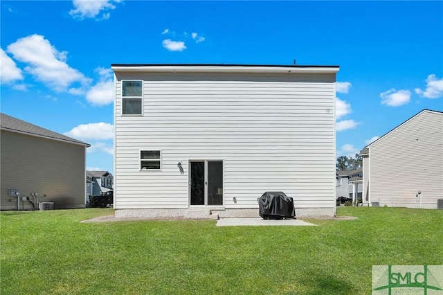 back of property featuring a patio area, cooling unit, and a lawn
