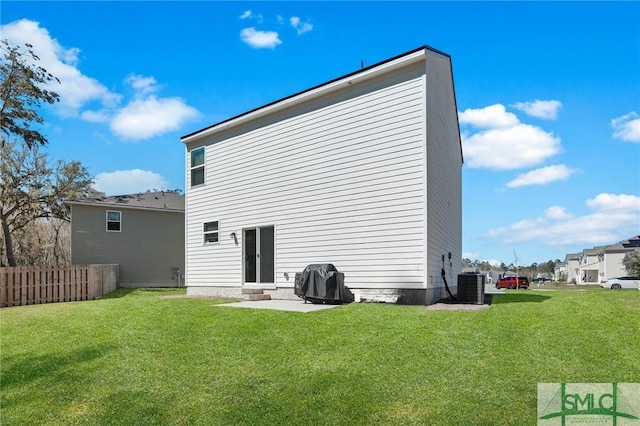 rear view of property with a patio, central AC, fence, and a lawn