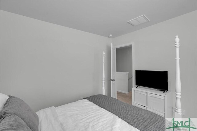 bedroom with carpet and visible vents