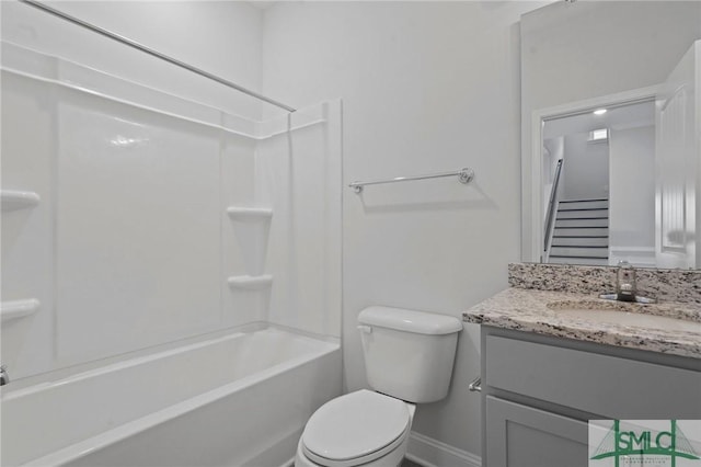 full bath with vanity, baseboards, shower / bathing tub combination, and toilet
