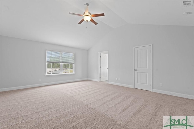 empty room featuring ceiling fan, carpet, visible vents, lofted ceiling, and baseboards