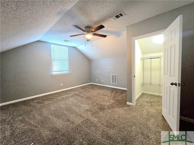 bonus room featuring visible vents, a ceiling fan, carpet floors, and a textured ceiling
