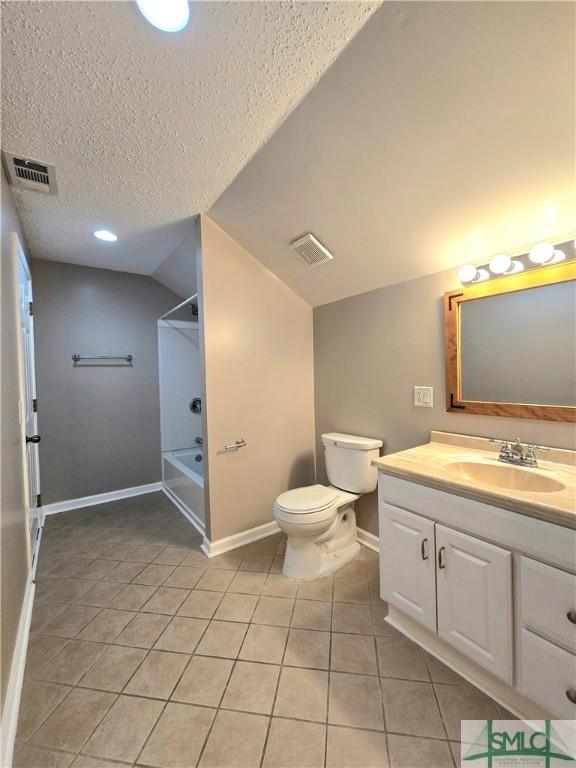 full bath featuring visible vents, washtub / shower combination, tile patterned flooring, and lofted ceiling
