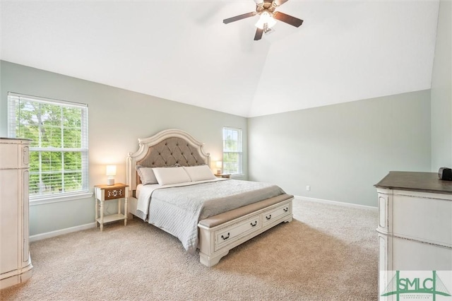bedroom with light colored carpet, baseboards, a ceiling fan, and lofted ceiling