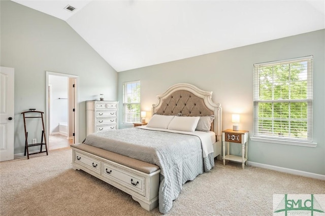 carpeted bedroom featuring visible vents, baseboards, and vaulted ceiling