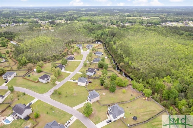 bird's eye view featuring a view of trees