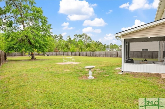 view of yard with a fenced backyard