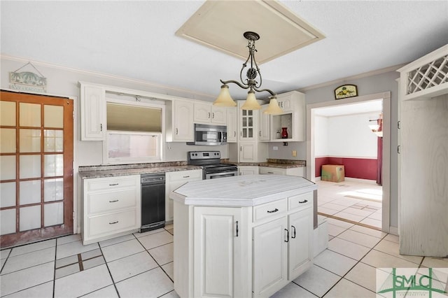 1505 Wilson Rd, Brooklet, GA 30415 - kitchen with a center island, appliances with stainless steel finishes, light tile patterned floors, and white cabinets