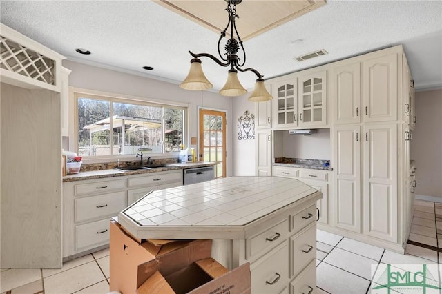 1505 Wilson Rd, Brooklet, GA 30415 - kitchen featuring light tile patterned floors, visible vents, dishwasher, a sink, and tile counters