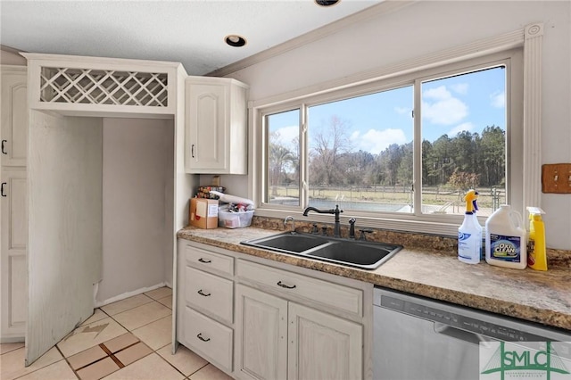 1505 Wilson Rd, Brooklet, GA 30415 - kitchen with white cabinets, dishwasher, a sink, and light tile patterned floors