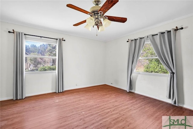 1505 Wilson Rd, Brooklet, GA 30415 - spare room featuring ceiling fan, wood finished floors, and baseboards