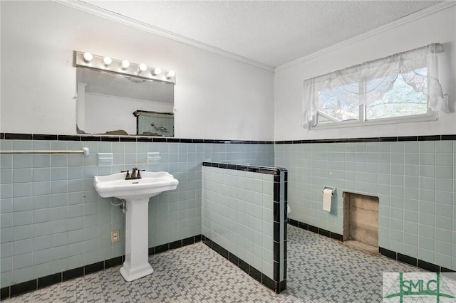 1505 Wilson Rd, Brooklet, GA 30415 - bathroom with crown molding, tile walls, tile patterned floors, and a textured ceiling