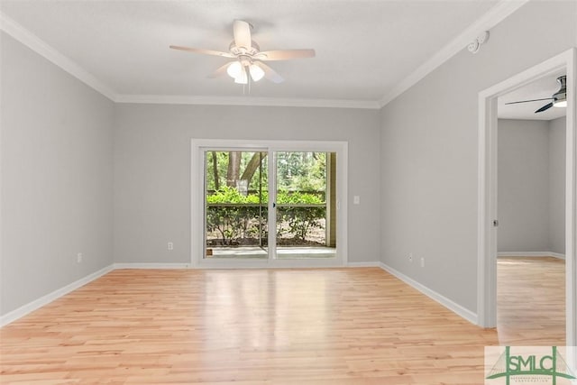 spare room featuring ornamental molding, light wood finished floors, baseboards, and a ceiling fan