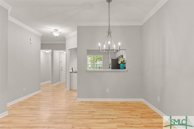 unfurnished dining area with a chandelier, wood finished floors, and baseboards