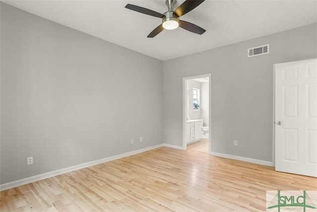 unfurnished bedroom featuring baseboards, a ceiling fan, connected bathroom, visible vents, and light wood finished floors
