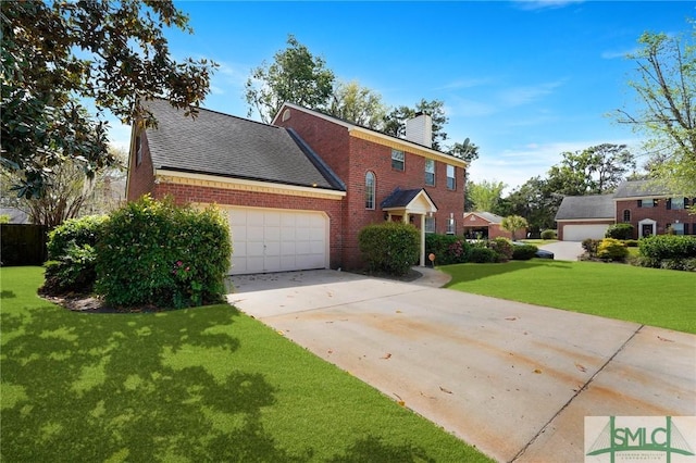 colonial inspired home with concrete driveway, a chimney, a front lawn, an attached garage, and brick siding
