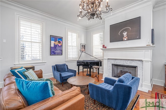 living room with plenty of natural light, an inviting chandelier, ornamental molding, and wood finished floors