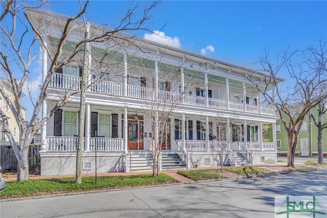 view of front of home featuring a porch and a balcony