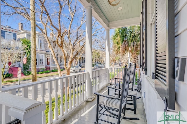 balcony featuring a porch and a residential view