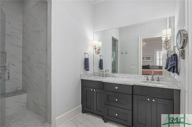 bathroom featuring marble finish floor, a sink, connected bathroom, and a marble finish shower