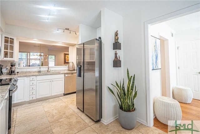 69 Brown Pelican Dr, Savannah, GA 31419 - bathroom featuring visible vents, baseboards, rail lighting, and vanity