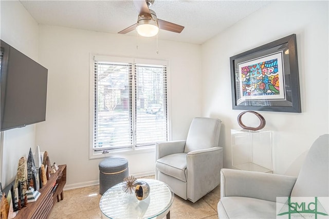 69 Brown Pelican Dr, Savannah, GA 31419 - living area featuring a textured ceiling, a healthy amount of sunlight, ceiling fan, and baseboards