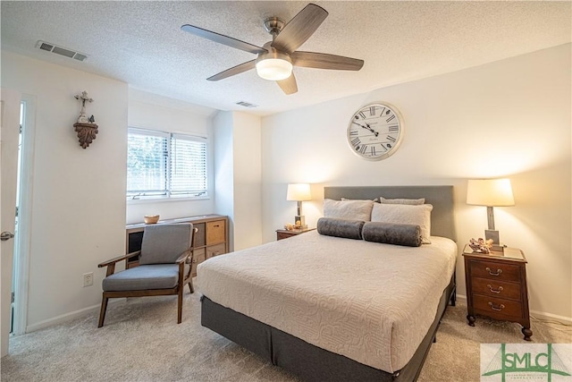 69 Brown Pelican Dr, Savannah, GA 31419 - bedroom featuring a textured ceiling, light colored carpet, ceiling fan, and visible vents