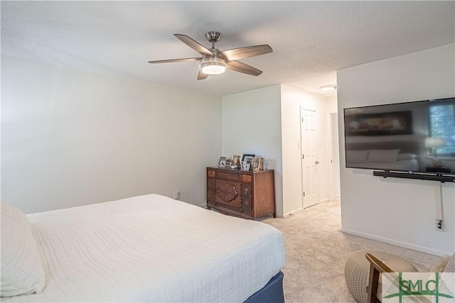 69 Brown Pelican Dr, Savannah, GA 31419 - carpeted bedroom with baseboards, ceiling fan, and a textured ceiling