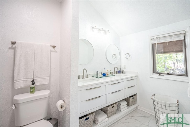 69 Brown Pelican Dr, Savannah, GA 31419 - full bathroom featuring double vanity, vaulted ceiling, toilet, marble finish floor, and a sink