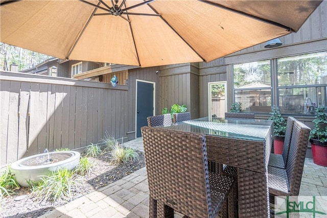 69 Brown Pelican Dr, Savannah, GA 31419 - view of patio / terrace with outdoor dining area and fence