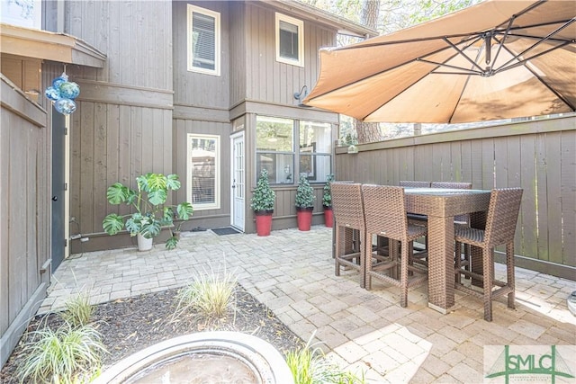 69 Brown Pelican Dr, Savannah, GA 31419 - view of patio / terrace with outdoor dining space and fence