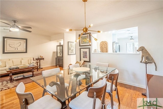 69 Brown Pelican Dr, Savannah, GA 31419 - dining room with light wood finished floors, baseboards, and ceiling fan