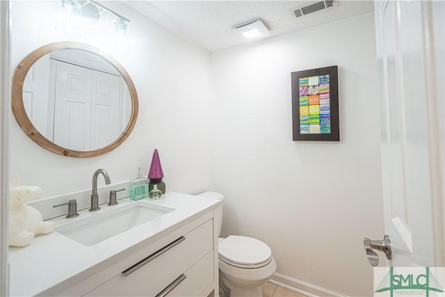 69 Brown Pelican Dr, Savannah, GA 31419 - bathroom featuring visible vents, toilet, a textured ceiling, vanity, and tile patterned floors