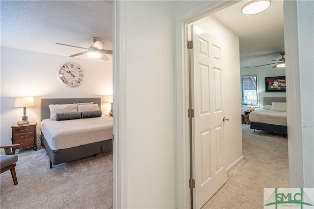 69 Brown Pelican Dr, Savannah, GA 31419 - bedroom featuring a ceiling fan, light carpet, and a textured ceiling