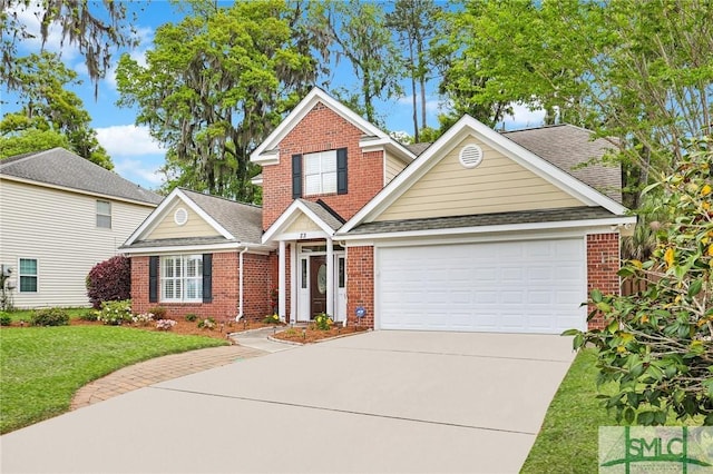 traditional-style home with roof with shingles, driveway, a front lawn, brick siding, and a garage