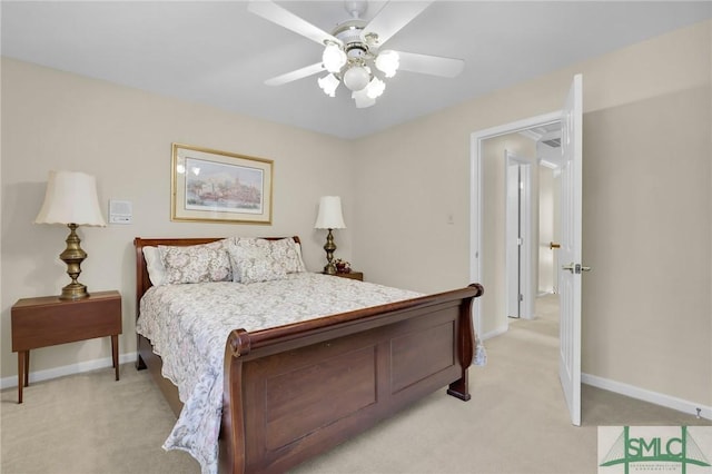 bedroom with baseboards, a ceiling fan, and light carpet