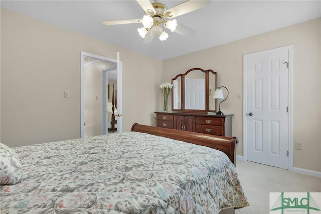 bedroom featuring baseboards, a ceiling fan, and light carpet