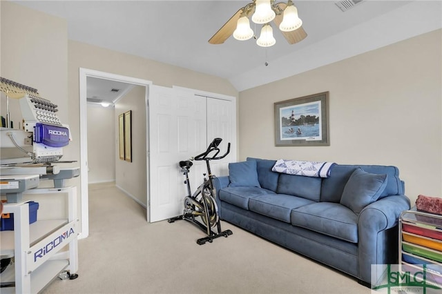 exercise area featuring visible vents, baseboards, a ceiling fan, vaulted ceiling, and light carpet