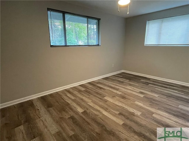 12509 Woodley Rd, Savannah, GA 31419 - spare room featuring dark wood-style flooring and baseboards