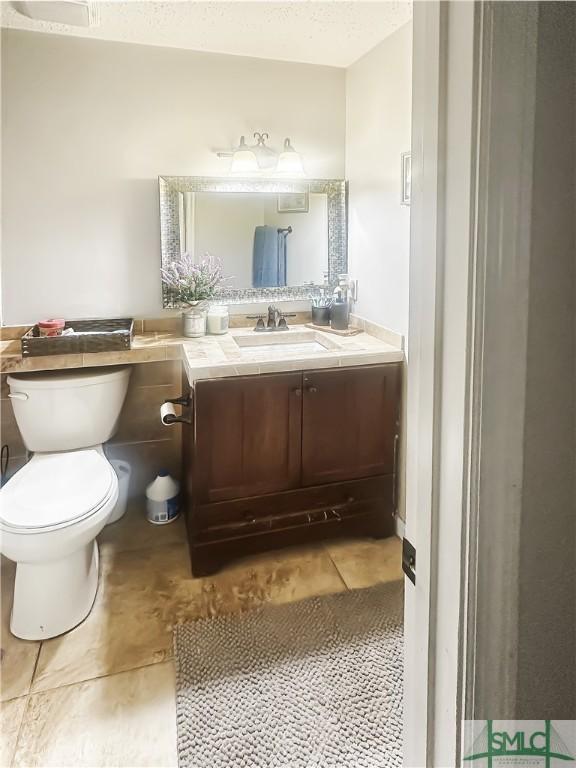 712 Fleming Rd, Hinesville, GA 31313 - bathroom featuring vanity and toilet