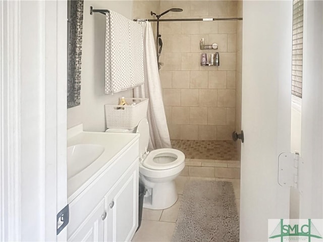 712 Fleming Rd, Hinesville, GA 31313 - bathroom featuring toilet, a shower stall, tile patterned flooring, and vanity