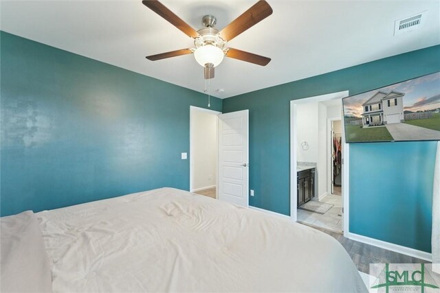 bedroom featuring visible vents, baseboards, and a ceiling fan