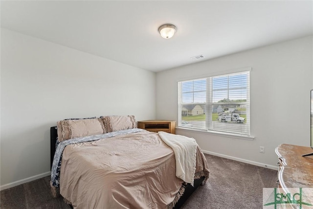 bedroom featuring carpet floors, baseboards, and visible vents