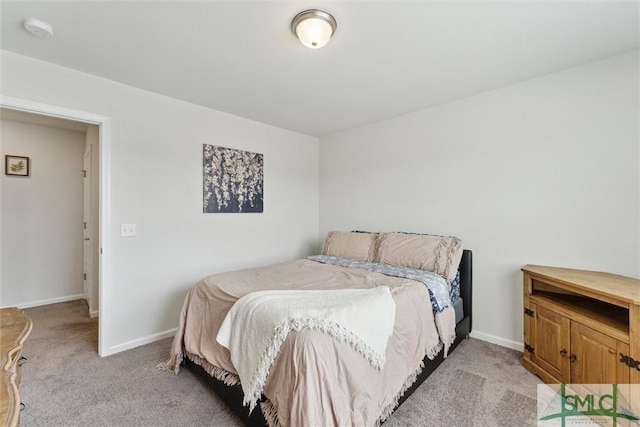 bedroom featuring light colored carpet and baseboards
