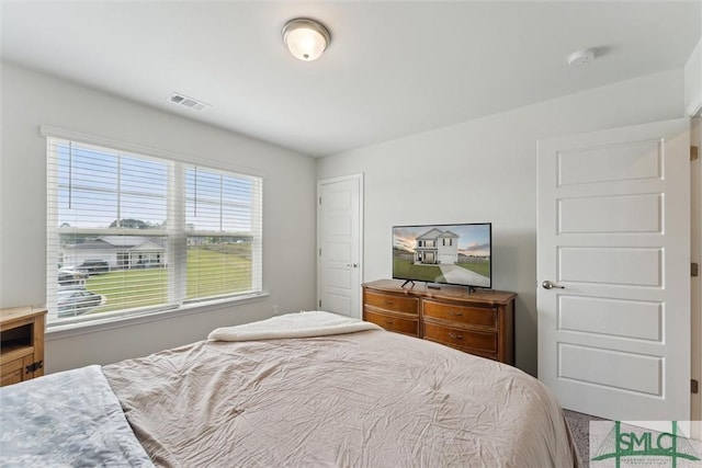 bedroom featuring visible vents
