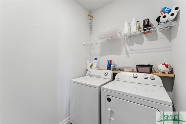 laundry room with independent washer and dryer, laundry area, and baseboards